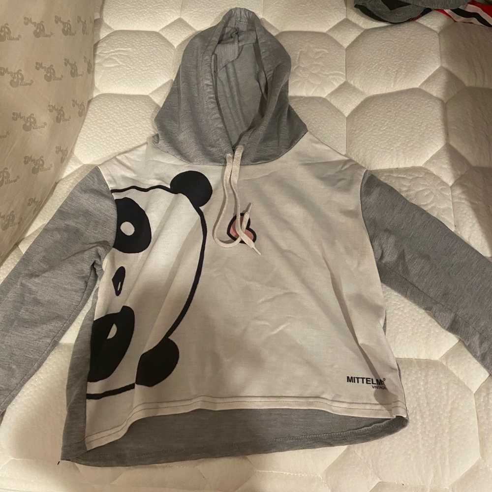 White crop top with a panda on it